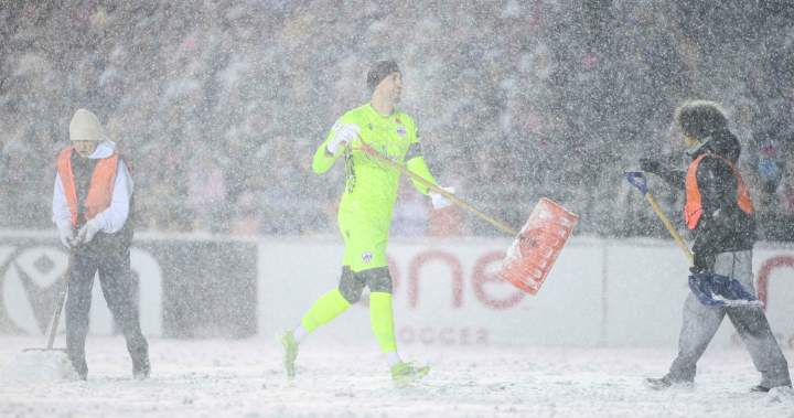 A snowy showdown: Canadian soccer players shovel snow, plows clear fie…